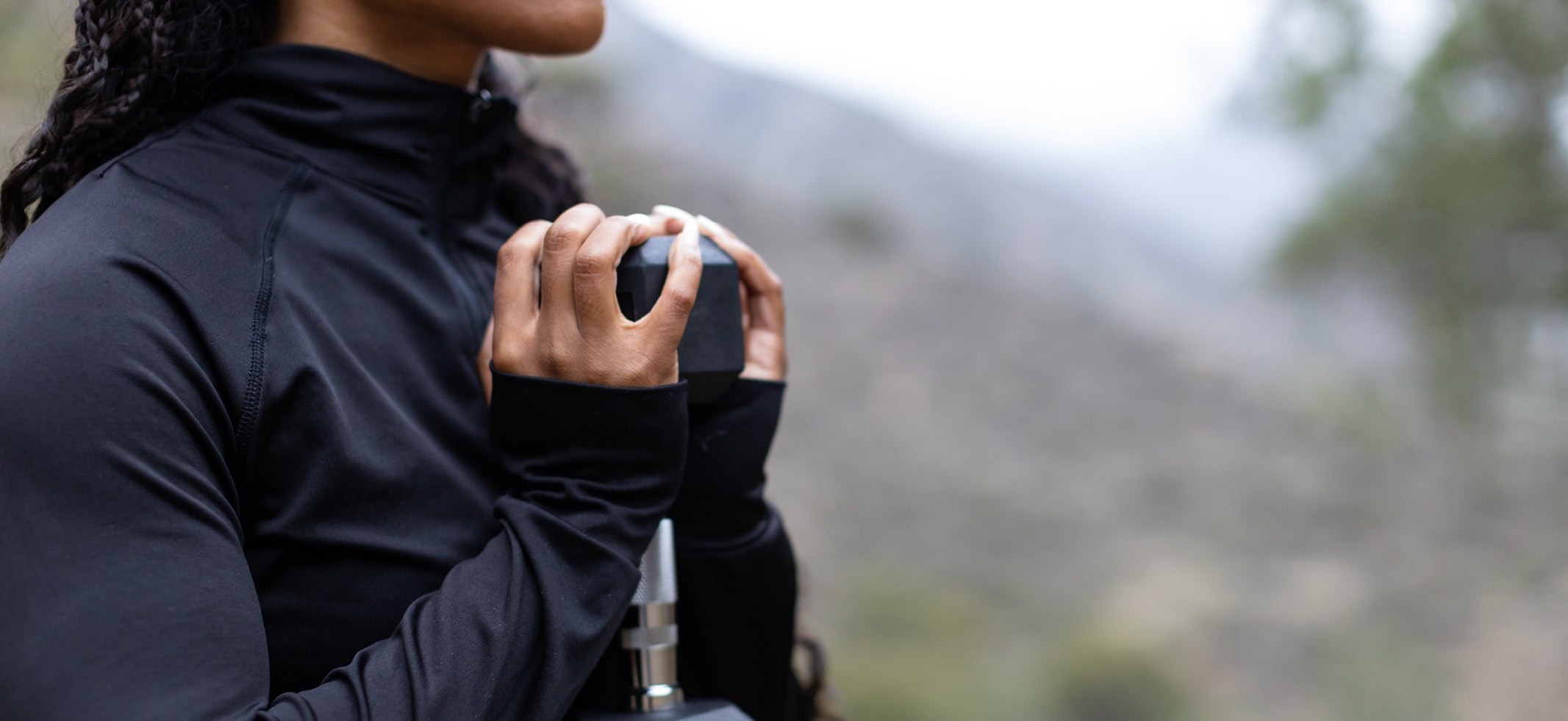 woman holding dumbbell