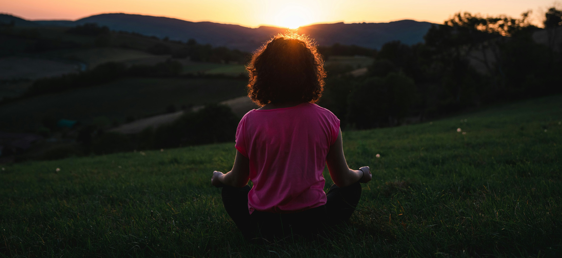 woman meditating outdoors