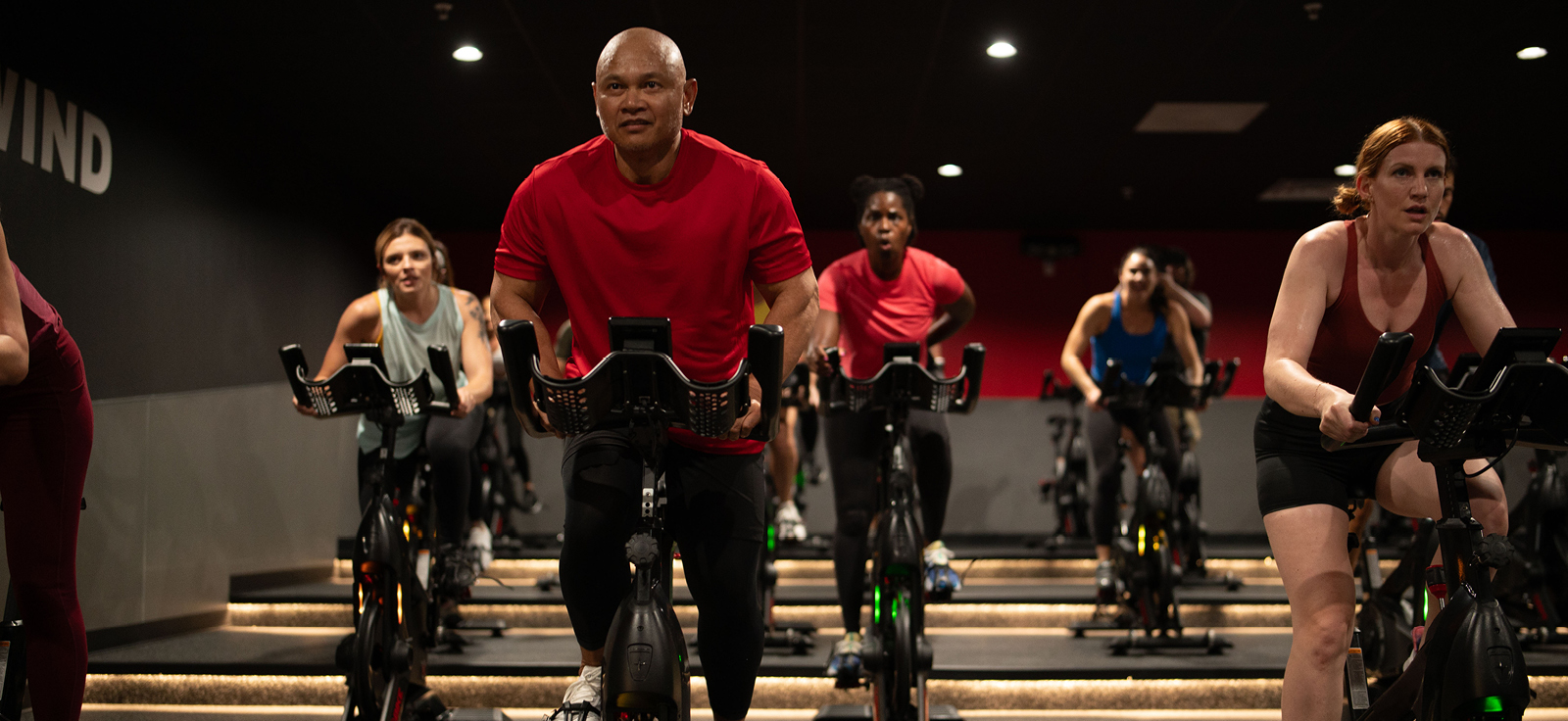 people on a stationary bike in a ride class