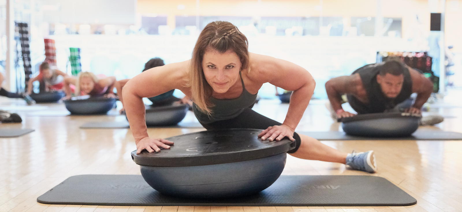 People in bosu fitness class