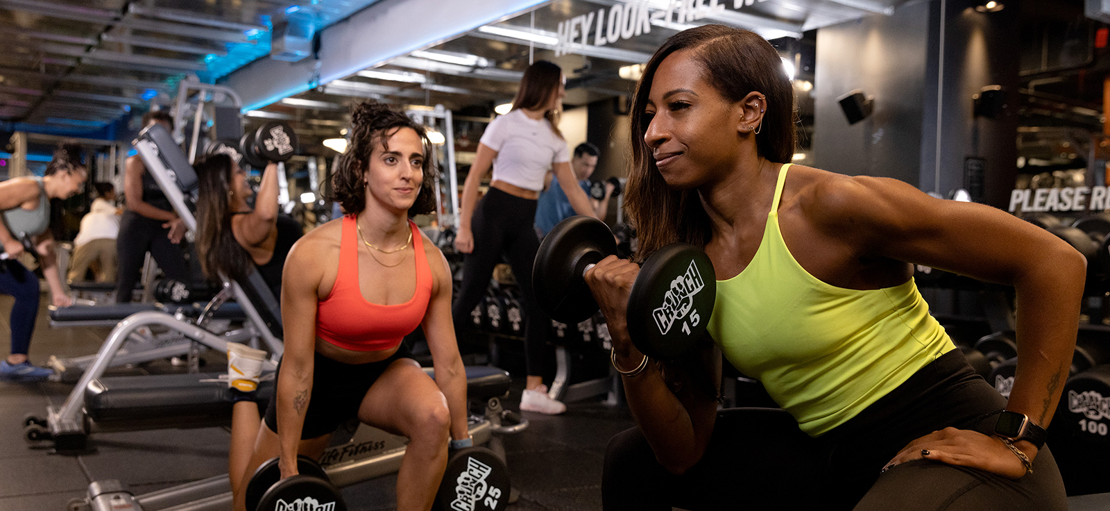 crunch members performing strength training