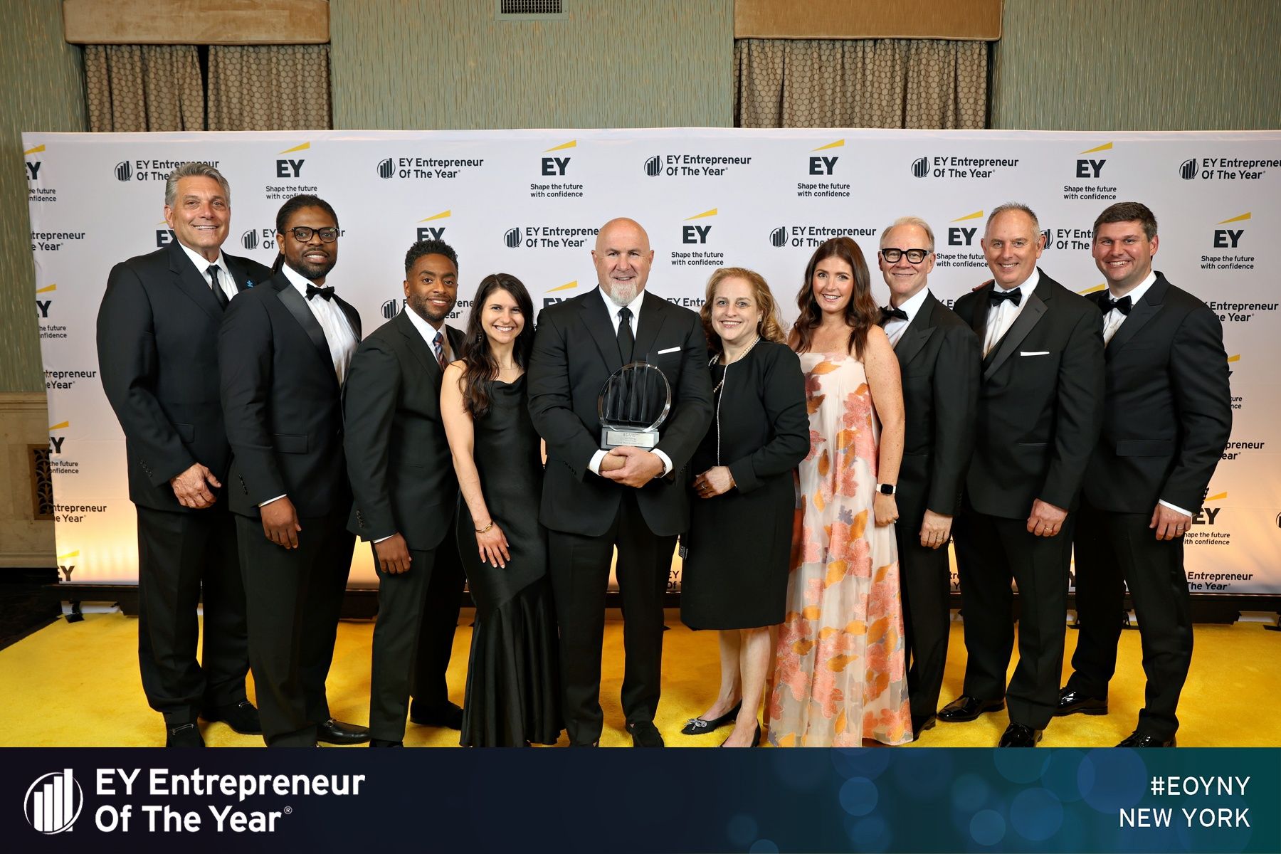Crunch Fitness Executive Team posing at Award ceremony